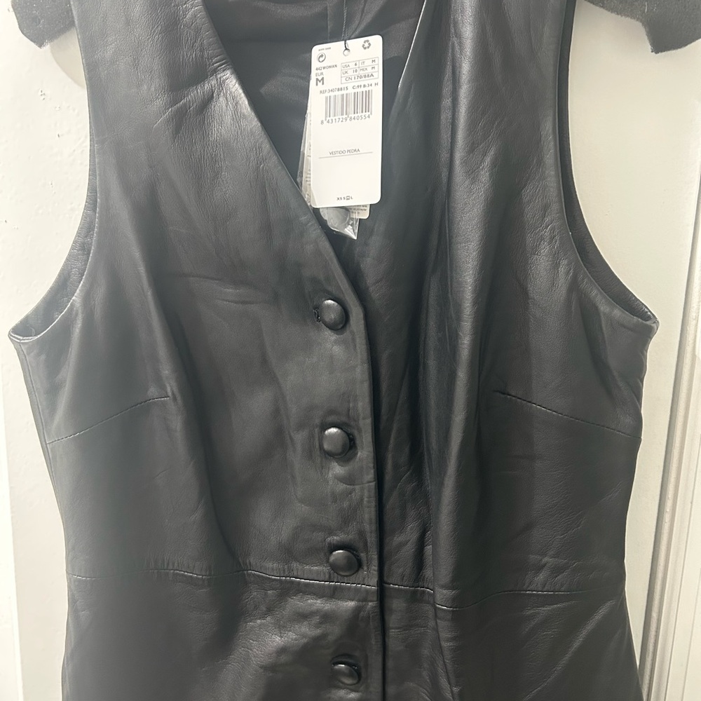 Mango short genuine leather sleeveless dress. Can be worn as a dress or a vest.